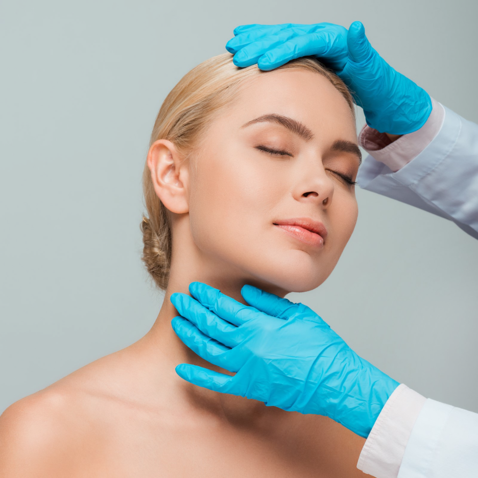 Woman undergoing a facial skin assessment as a skincare professional examines her forehead and jawline.